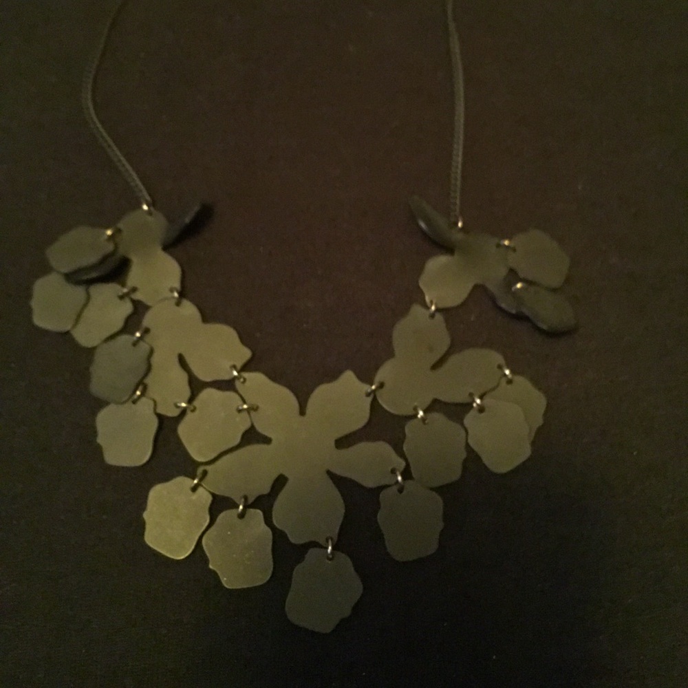 Matte black flower necklace.